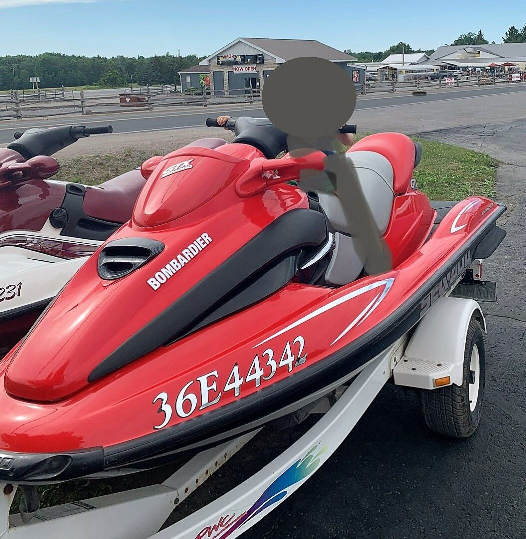 Red 2000 stolen PWC with ‘Bombardier 36E4432’ written on the side and ‘GTX Sea Doo’ in front of the steering handle.