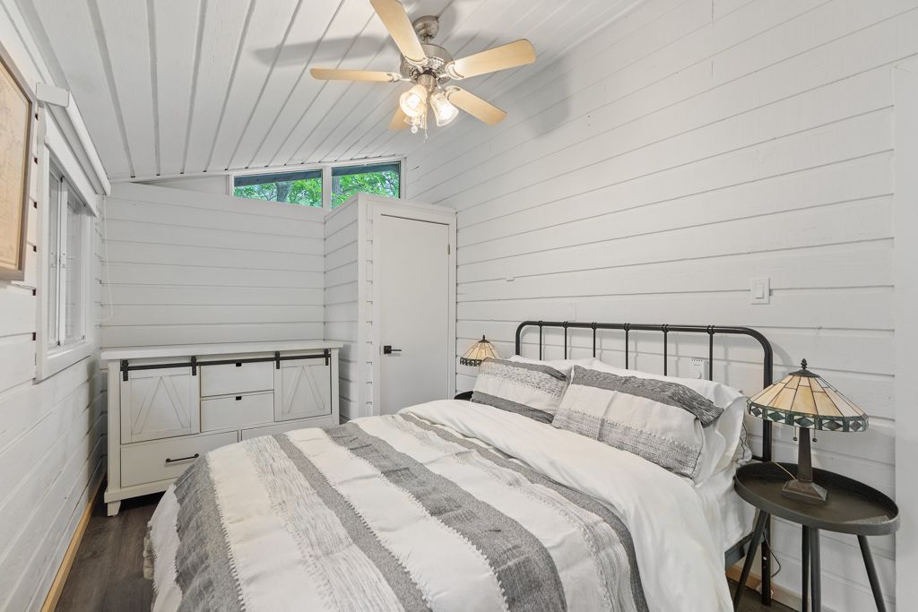 A bright bedroom with a big bed.