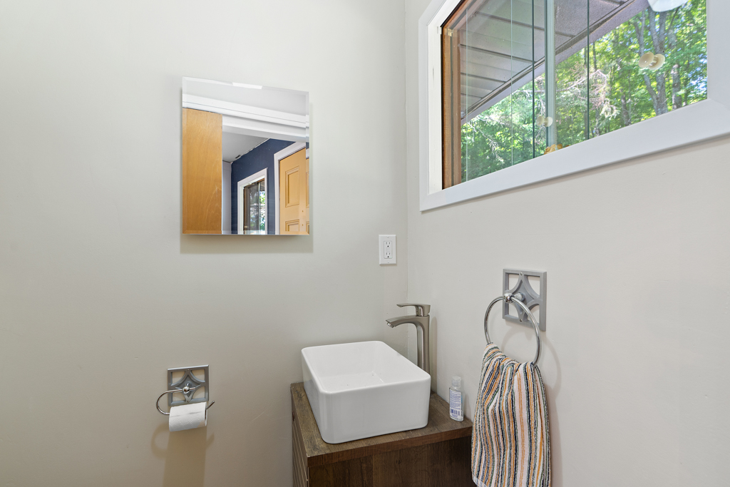 A small bathroom with a sink.