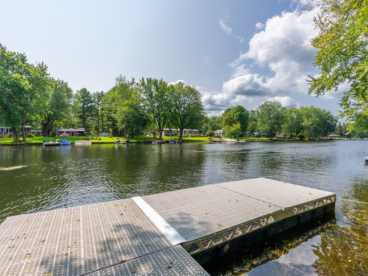 View across a river from a small dock.