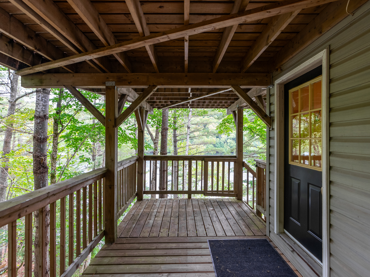 A secondary entrance into a cottage off a lower-level deck.