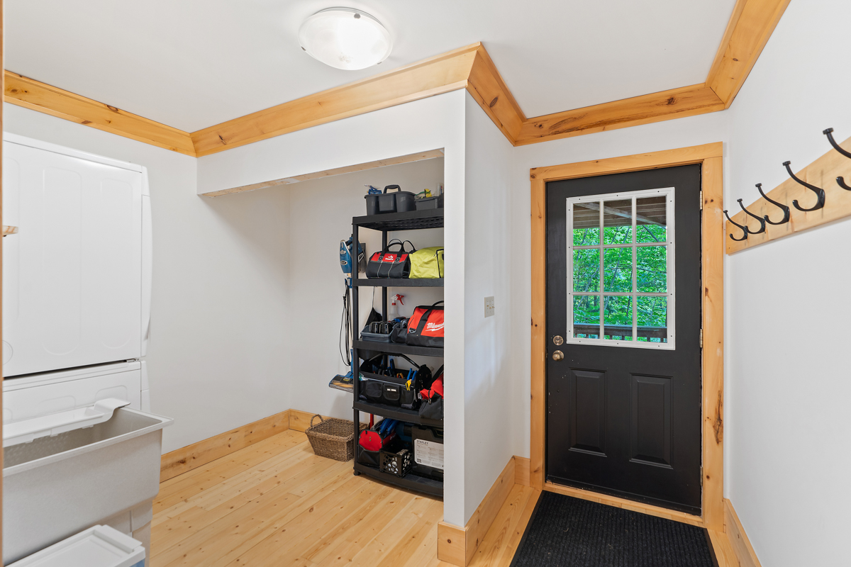 The door of a secondary entrance leads to a deck outside.