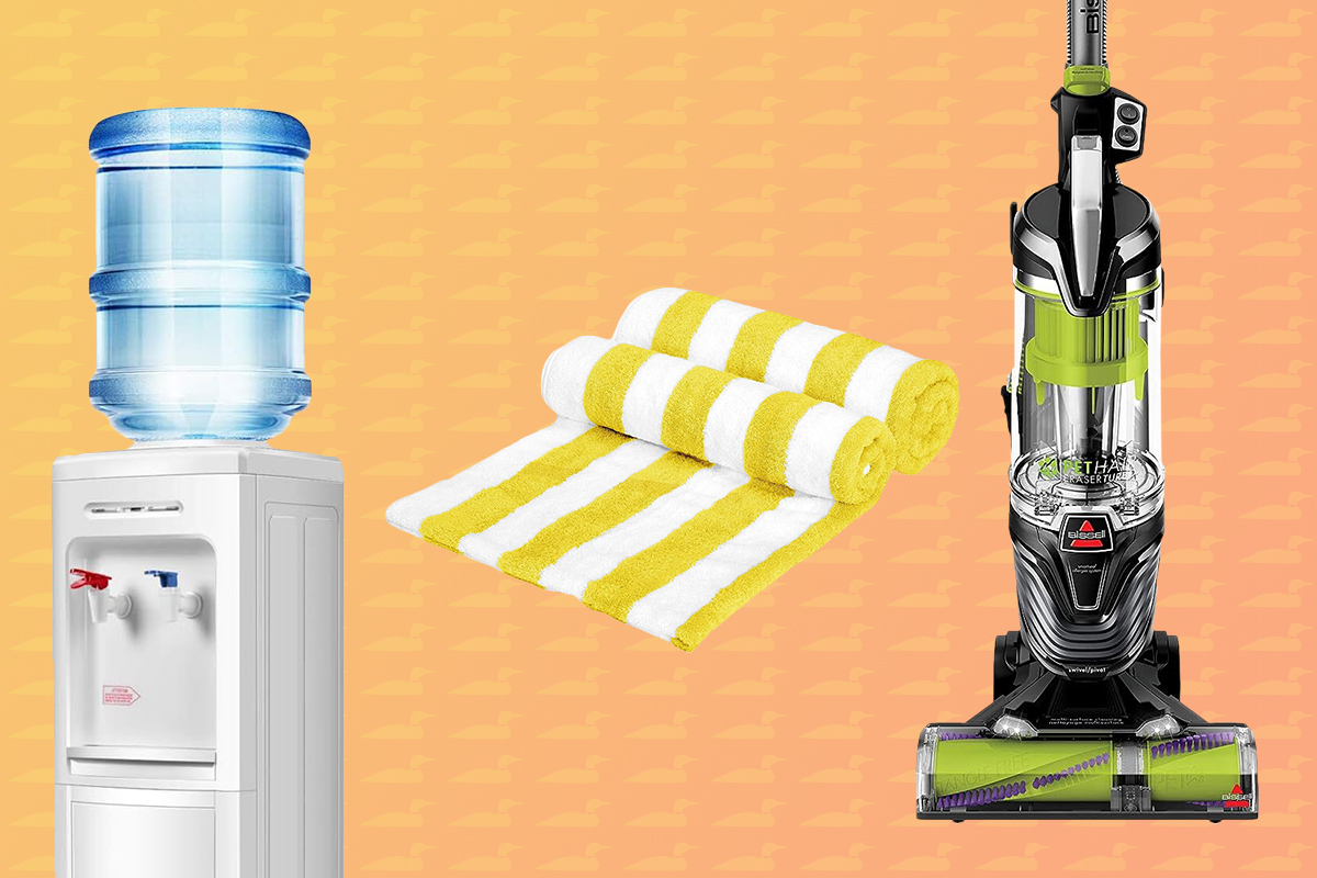 cottage necessities on a orange ombre background including a vacuum, water cooler, and beach towels