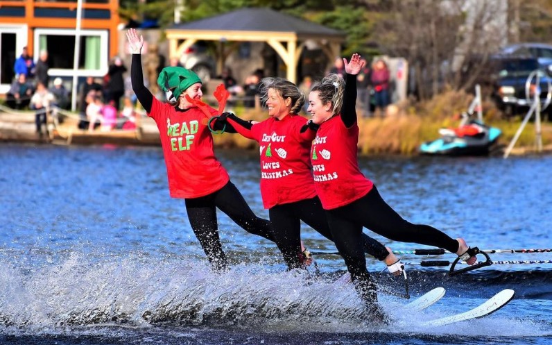 Three people slalom ski