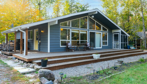 Front of cottage. Floor-to-ceiling windows span the front of the bungalow.
