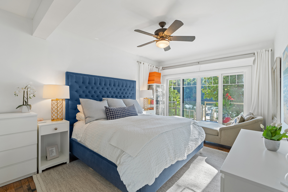 A bright bedroom with a large bed.