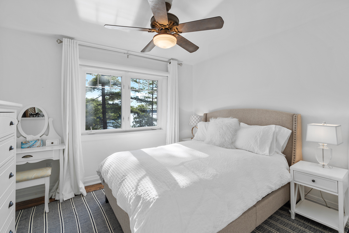 A bright bedroom with a big bed.