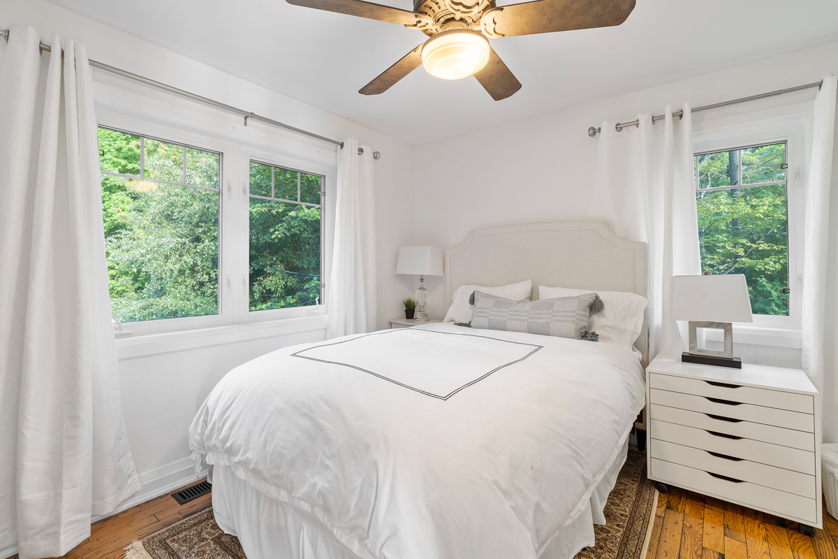 A bright bedroom with a large bed.