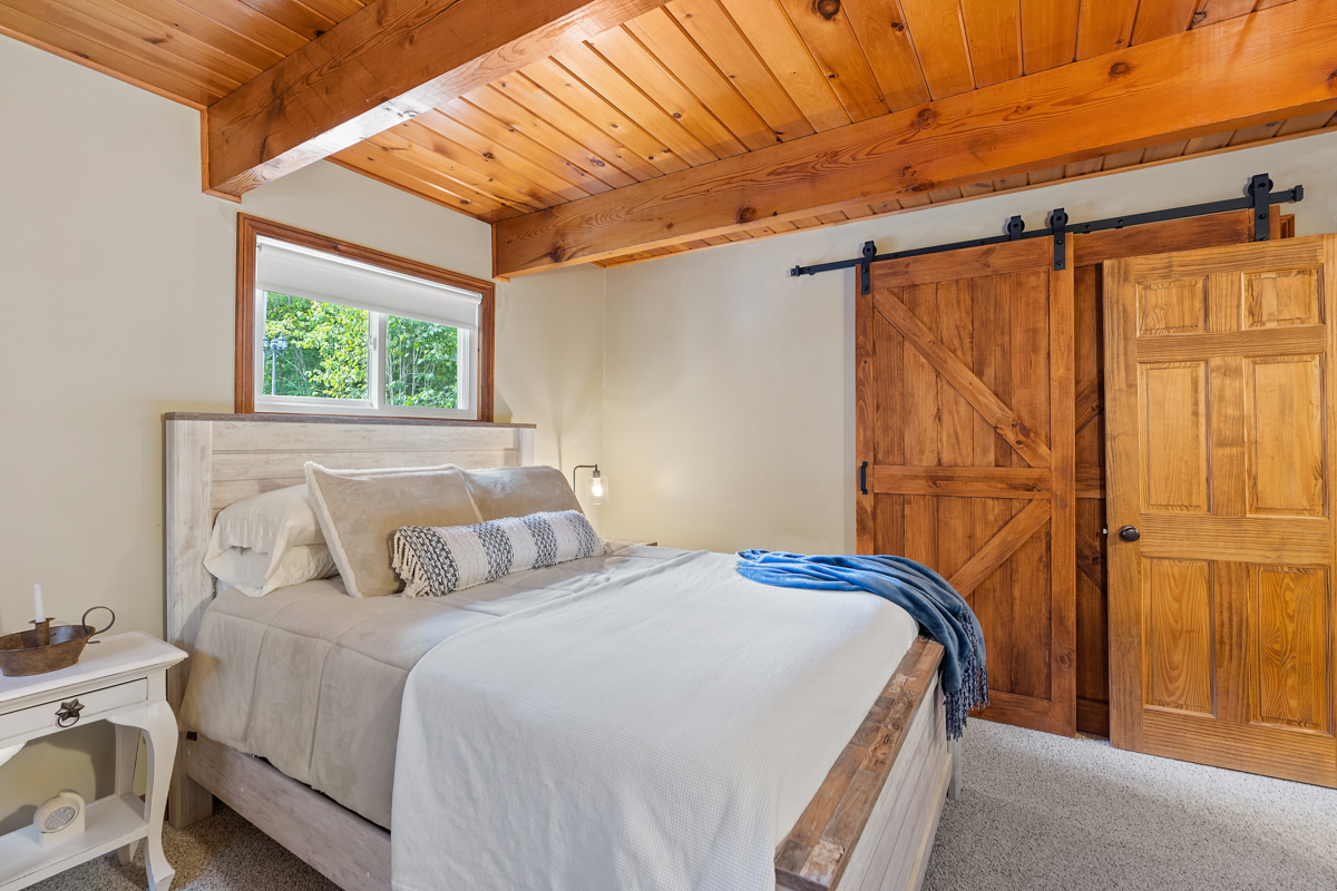 A bright bedroom with a large bed.