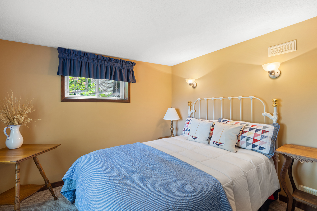 A bright bedroom with a big bed.