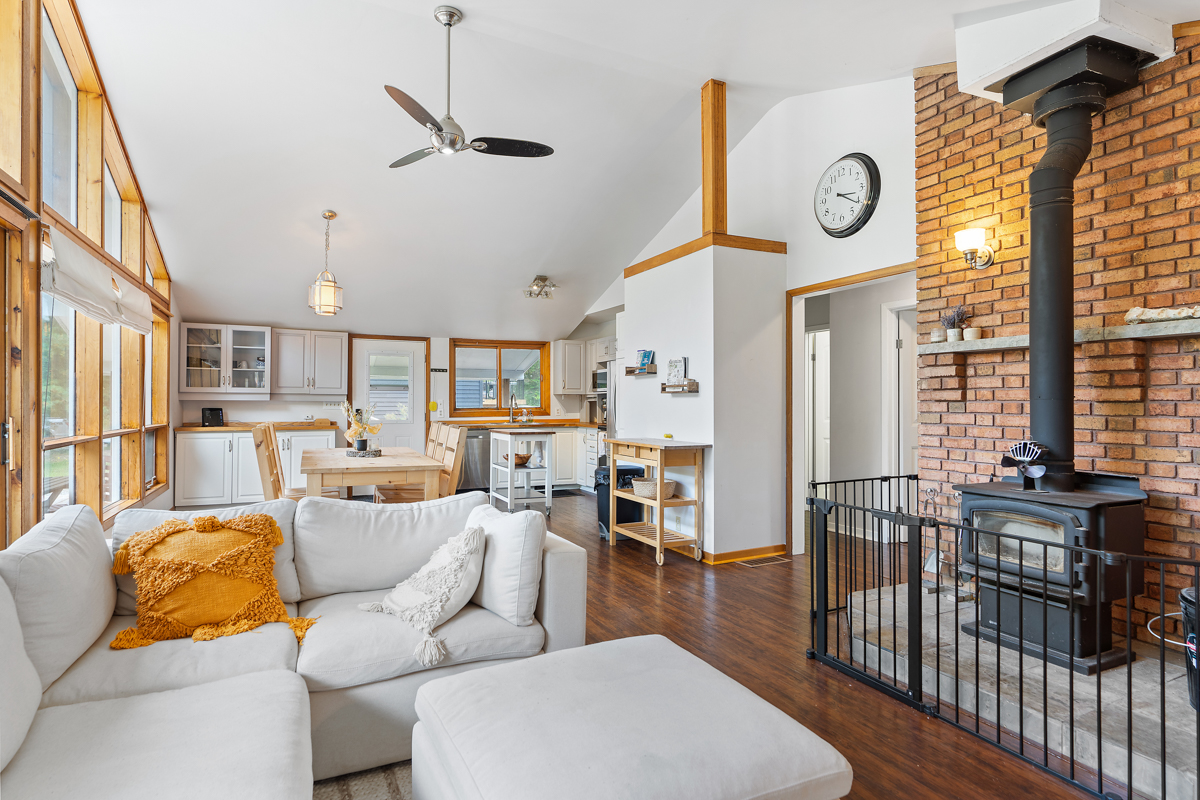 A bright, main floor bungalow space that flows from the living area to the dining and kitchen area.