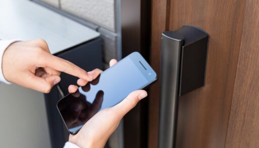 person unlocking door with a smartphone