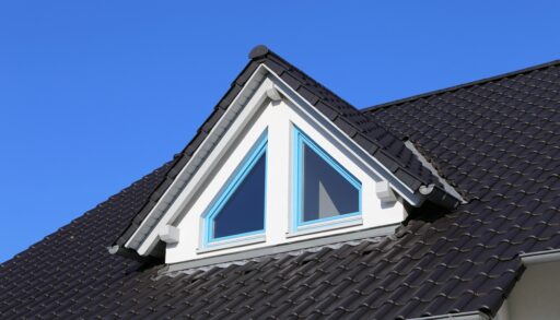 A dormer window on a tiled roof
