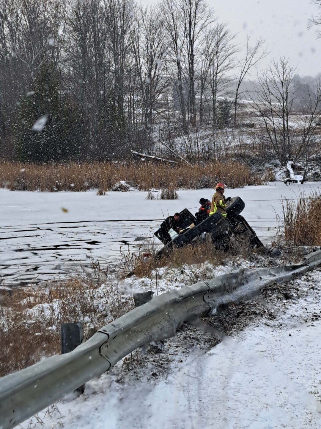 Emergency services help rescue the driver
