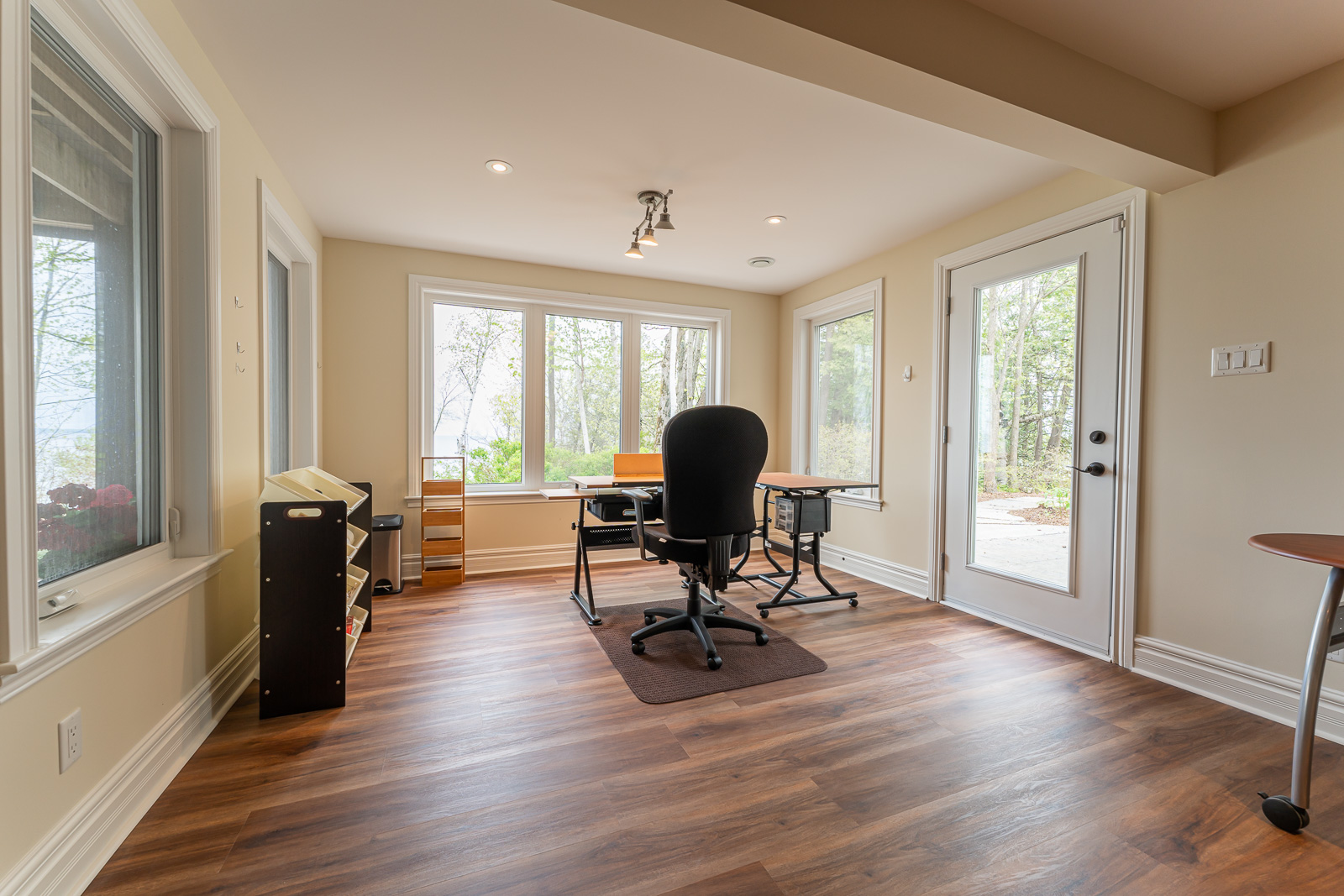A bright space with a desk and an office chair, with lots of natural light.