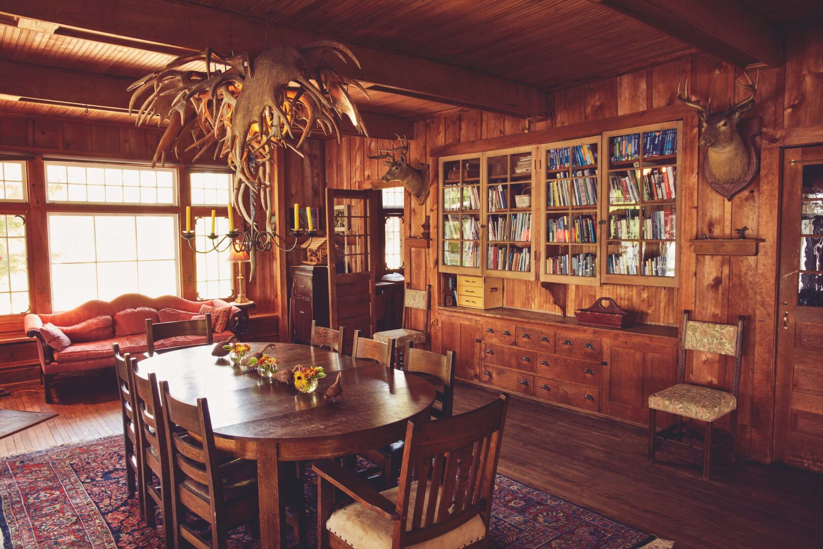A photo of a built-in storage unit with mounted book shelves storage beneath