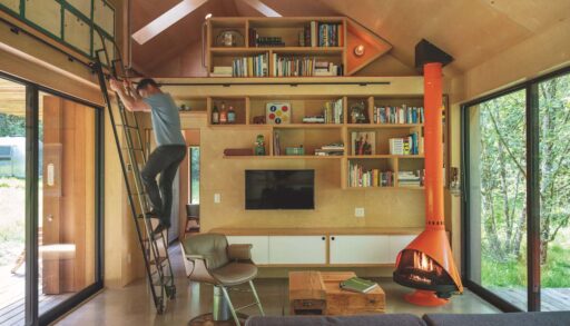 A photo of an Oregon retreat with plenty of built-in storage including a rolling ladder