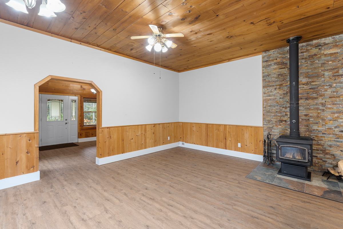 A spacious living area, empty and un-staged.