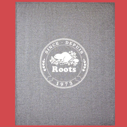 a salt and pepper roots blanket on a red background