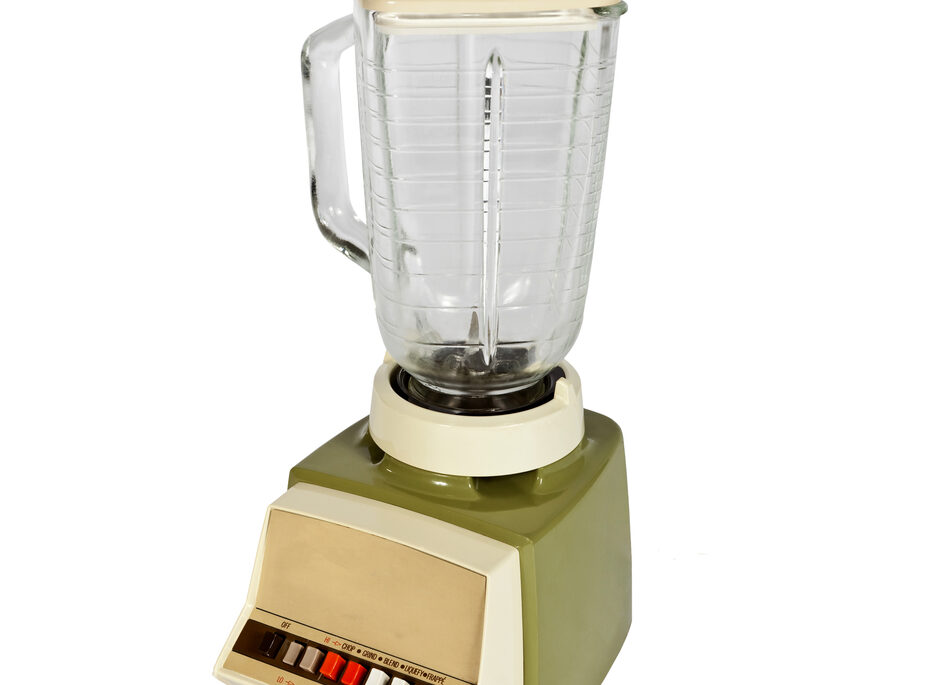 A vintage blender against a white background