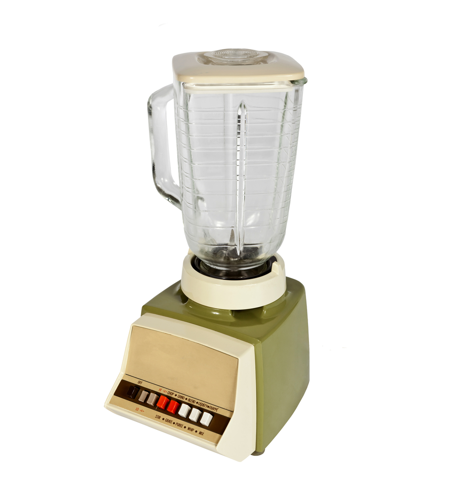 A vintage blender against a white background