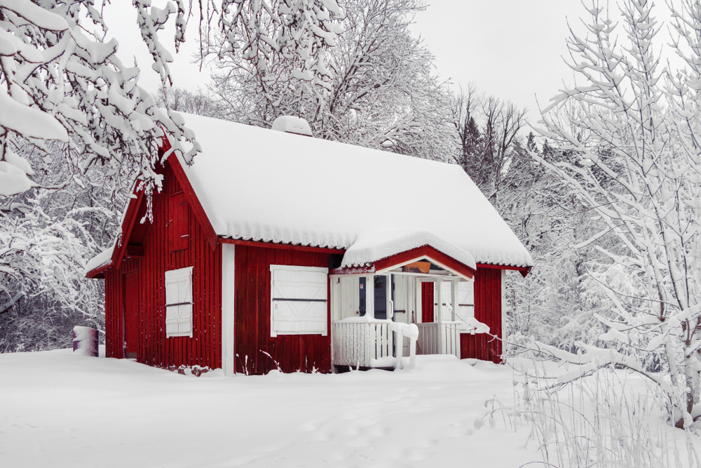A red, snow covered cabin
