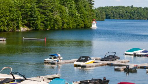 Boats and a lighthouse on Joseph Lake in Muskoka, Ontario