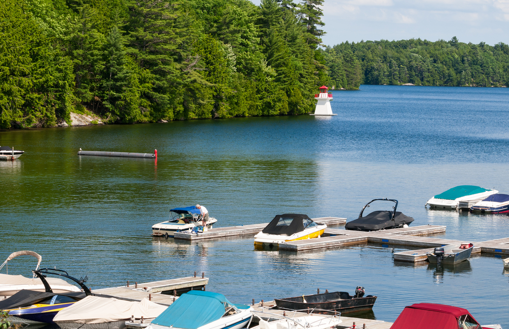 Boats and a lighthouse on Joseph Lake in Muskoka, Ontario
