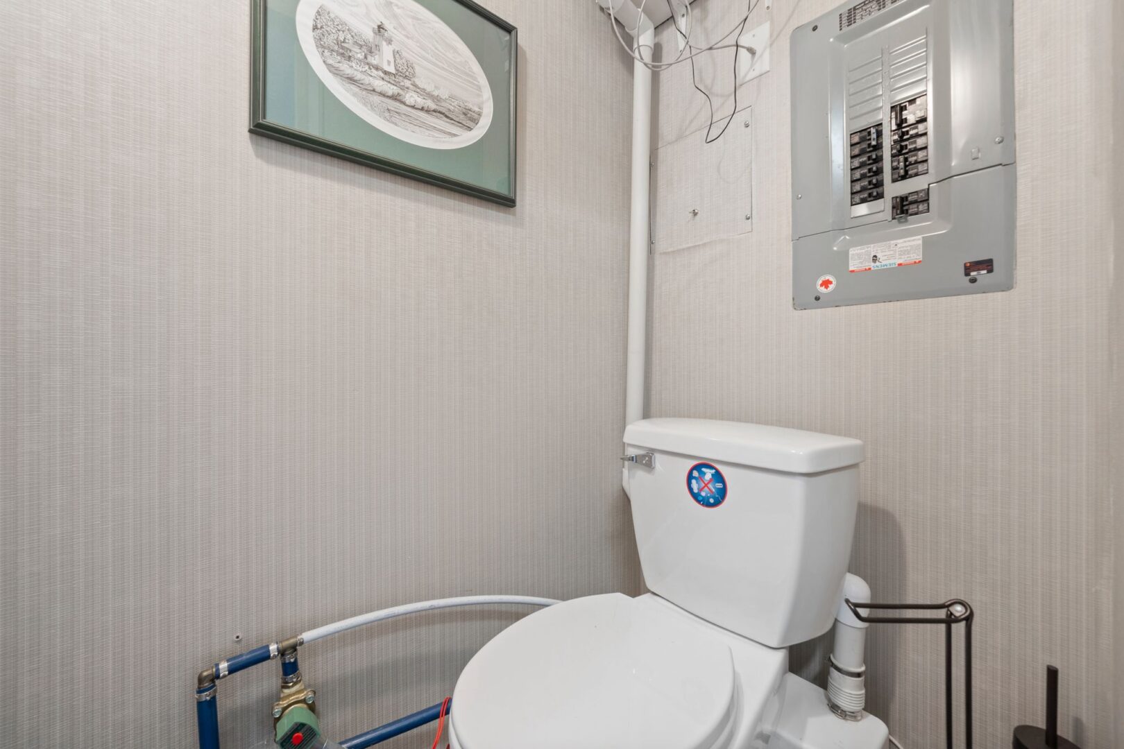 A small bunkie bathroom with a toilet.