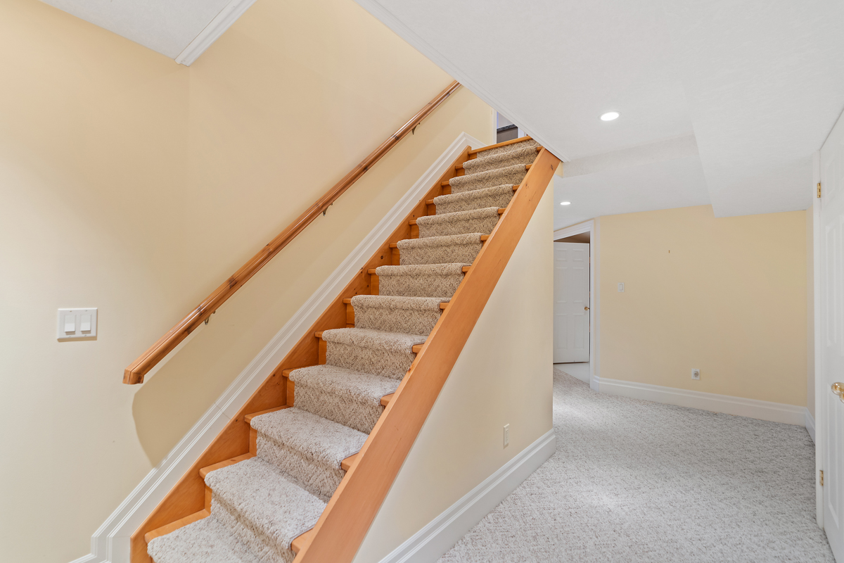 A staircase leads down into a basement area.