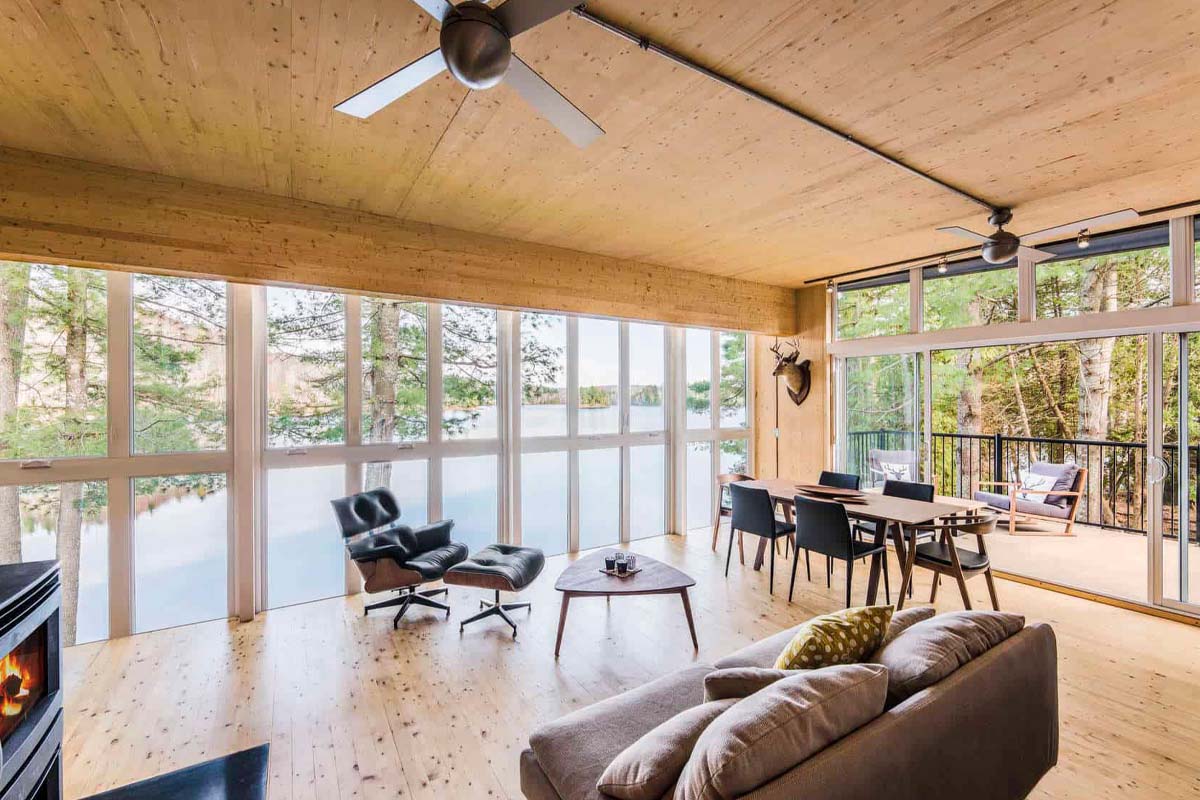 A wood-walled room with windows