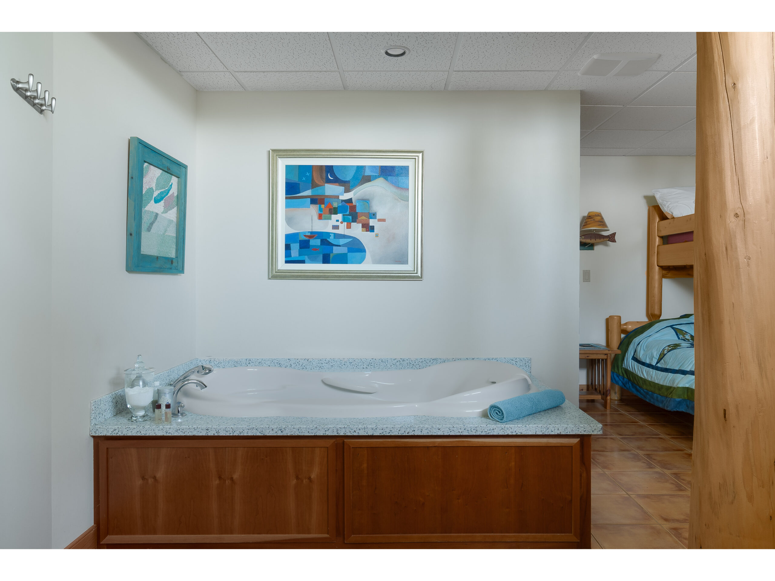 A jacuzzi tub. Around the corner are bunk beds.