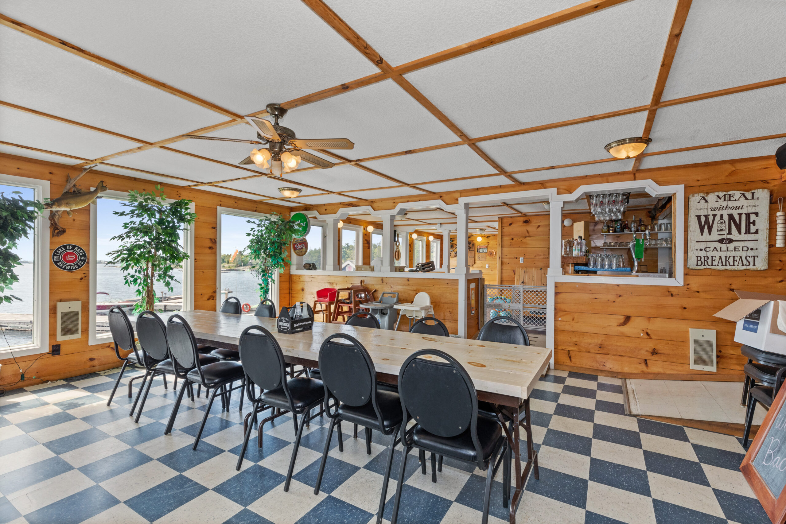 a dining area with a table and checkered floors