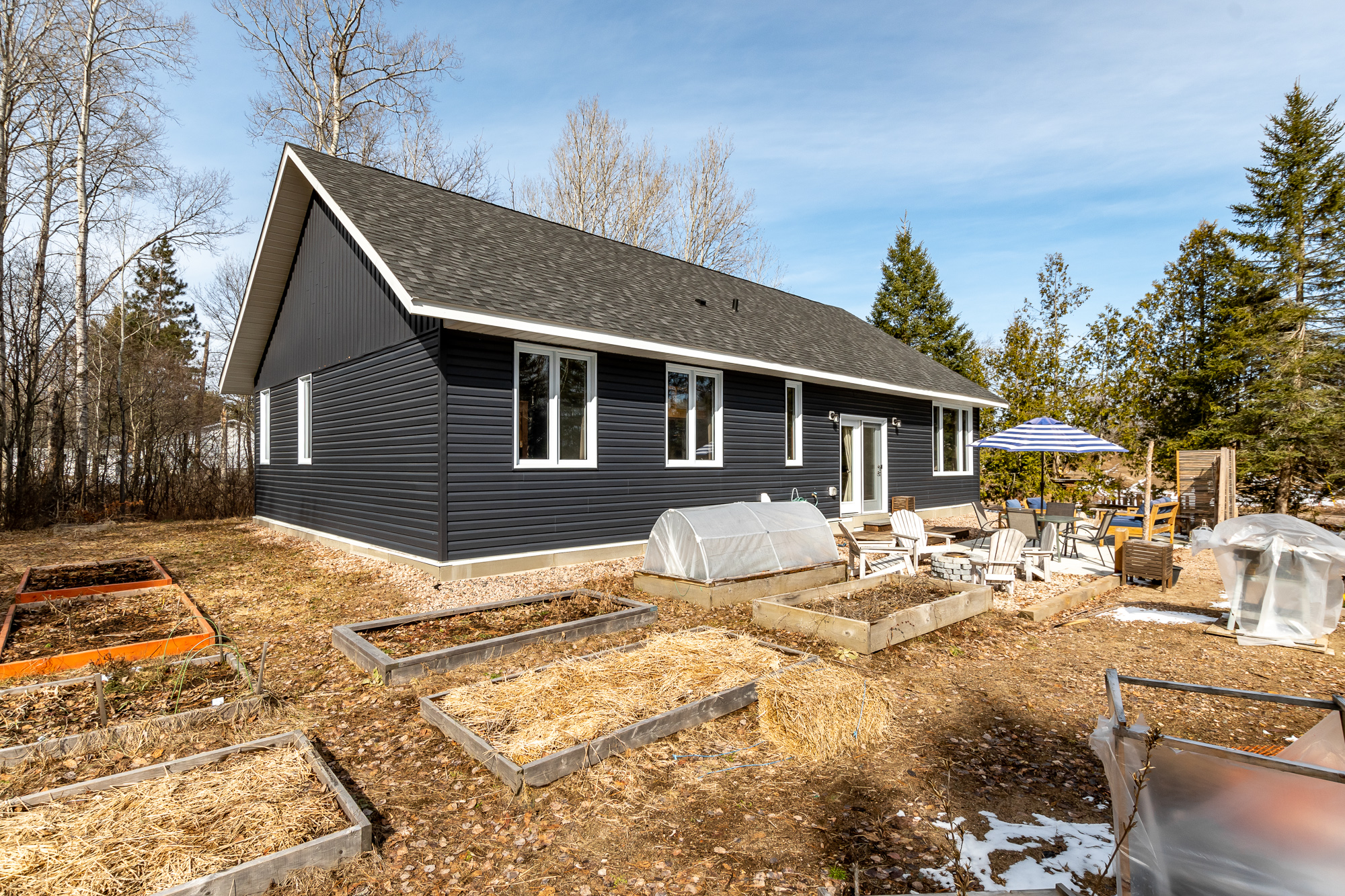 Rows of vegetable garden beds in the backyard