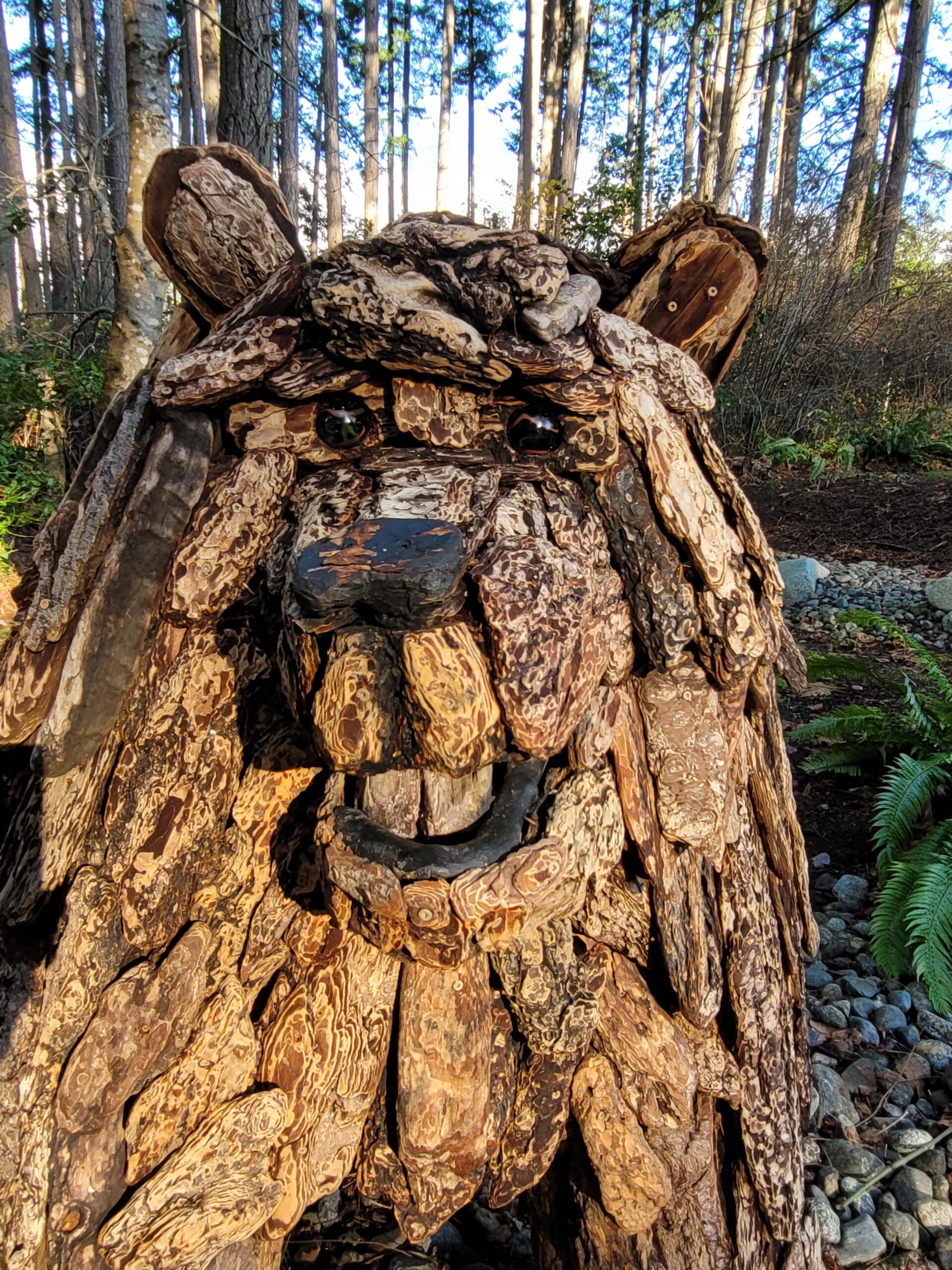 a driftwood sculpture of a bear
