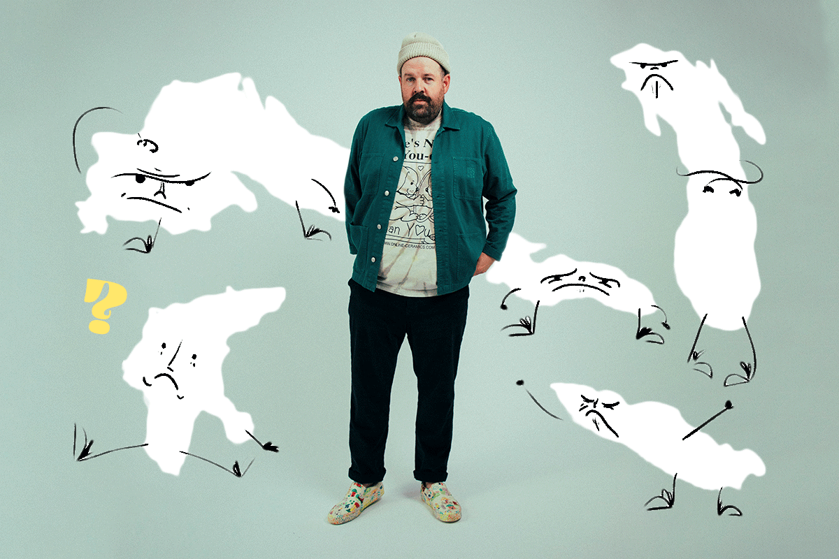 Donovan Woods stands on a blue background surrounded by anthropomorphic sketches of the Great Lakes who are grumpy about his ranking