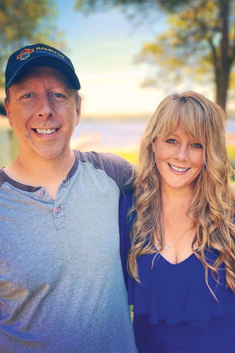 a man and woman stand beside eachother