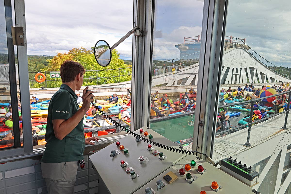 people in kayaks and canoes on the trent-severn waterway in peterborough