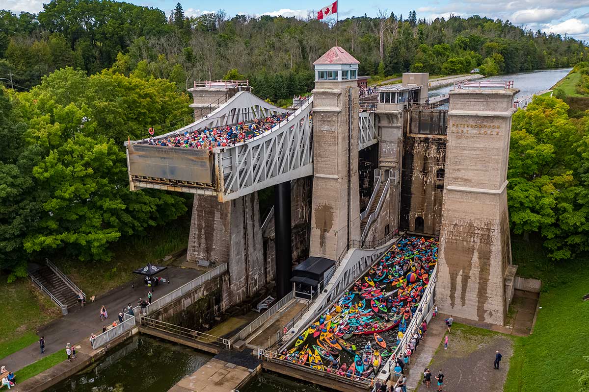 people in kayaks and canoes on the trent-severn waterway in peterborough
