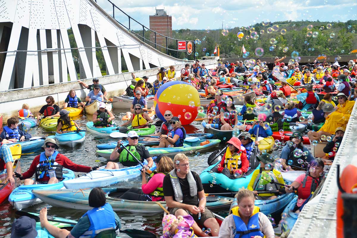 people in kayaks and canoes on the trent-severn waterway in peterborough