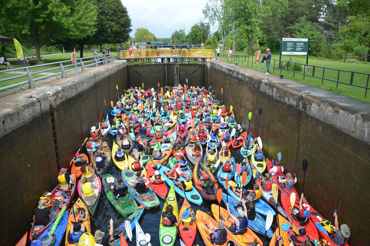 people in kayaks and canoes on the trent-severn waterway in peterborough