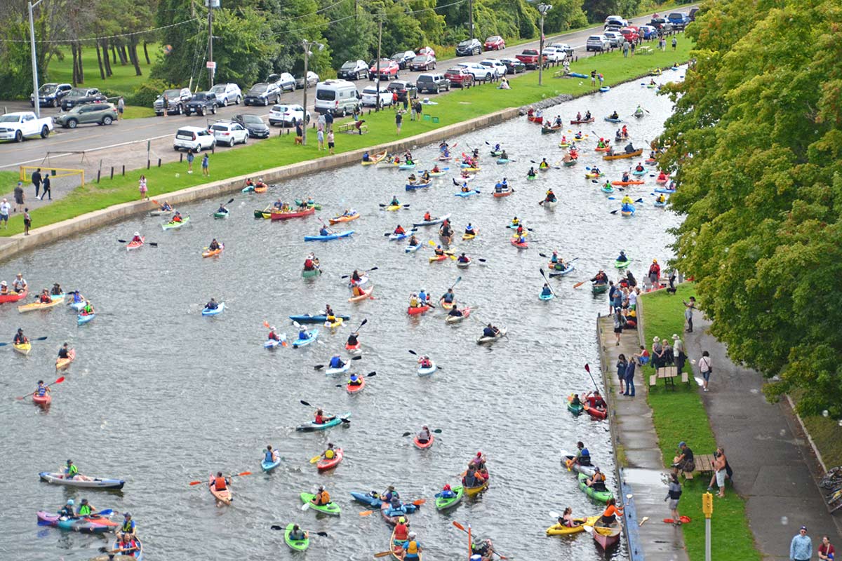 people in kayaks and canoes on the trent-severn waterway in peterborough