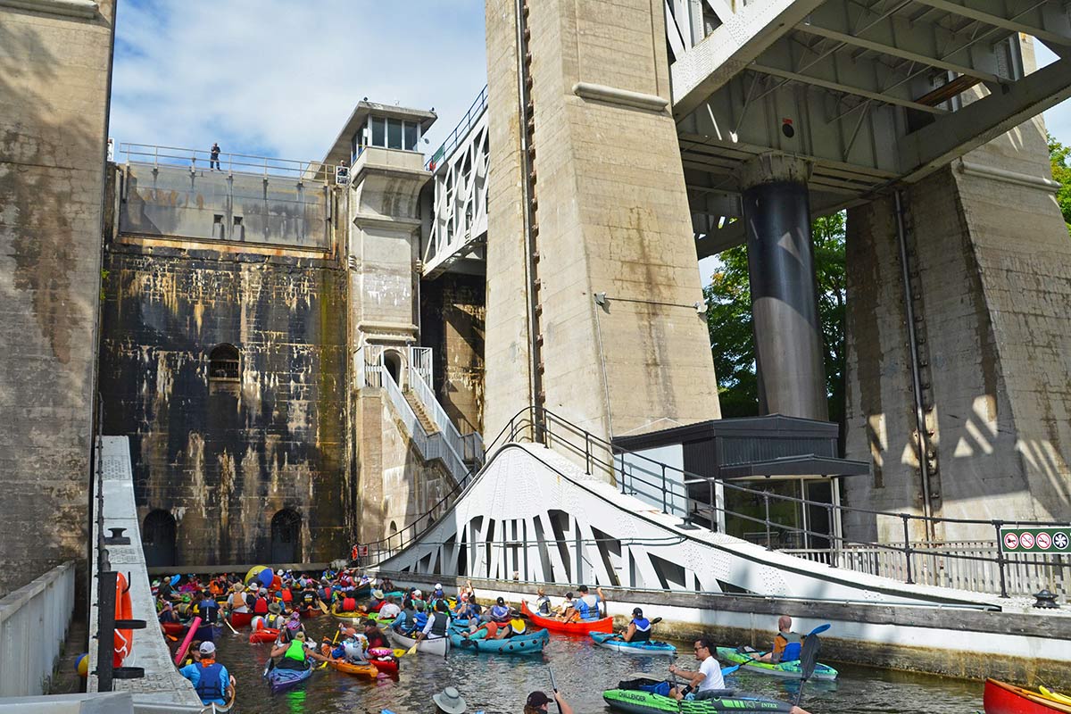 people in kayaks and canoes on the trent-severn waterway in peterborough