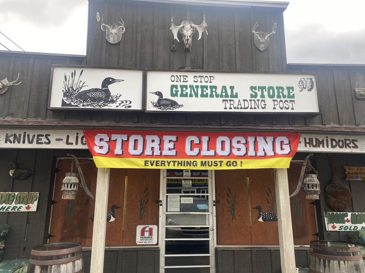 Store closing sign on the one stop general store in Huntsville, Ont.