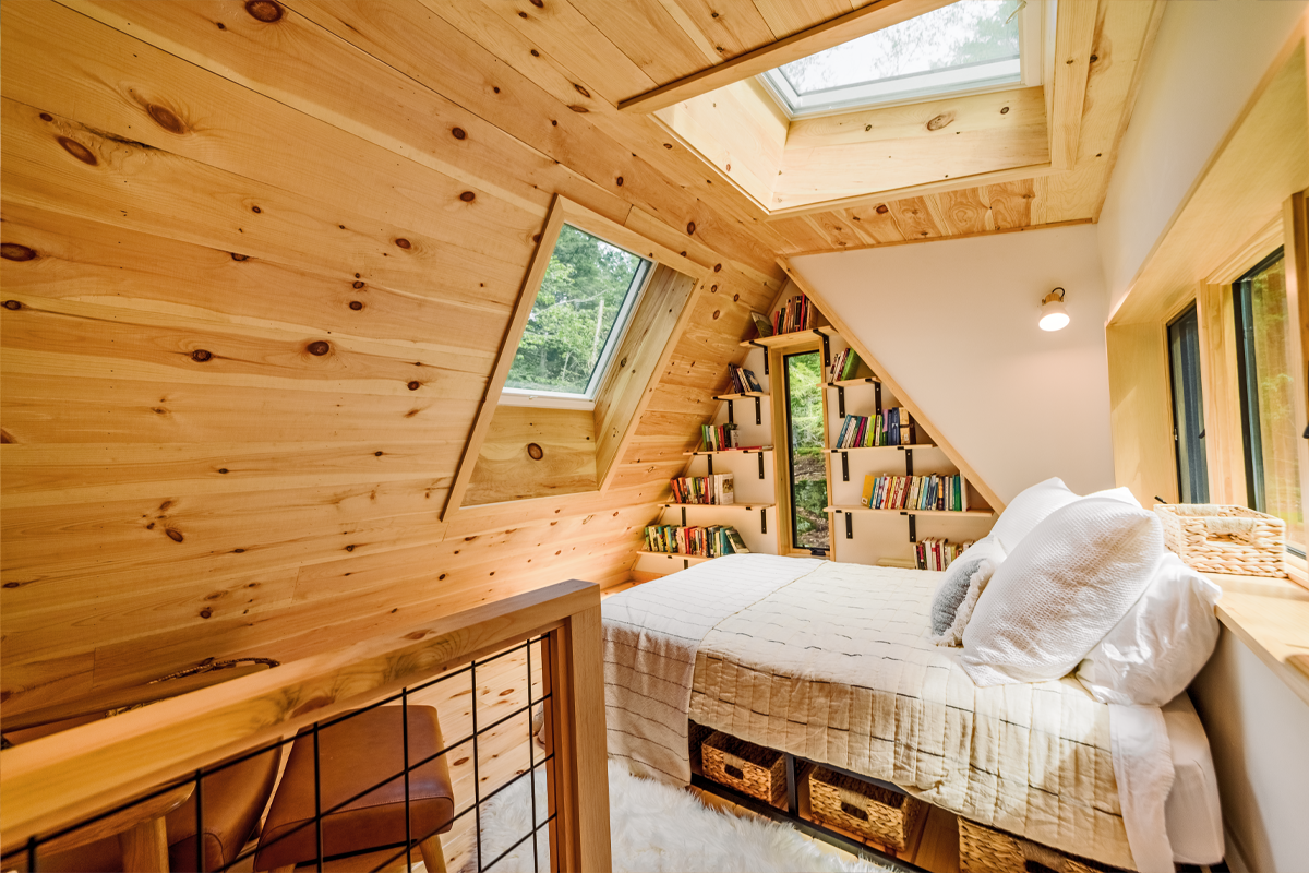 Photo of a bedroom with a skylight above the bed