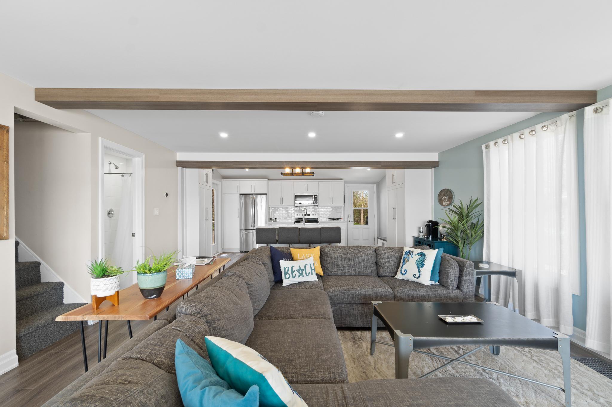 a living room with a sectional couch