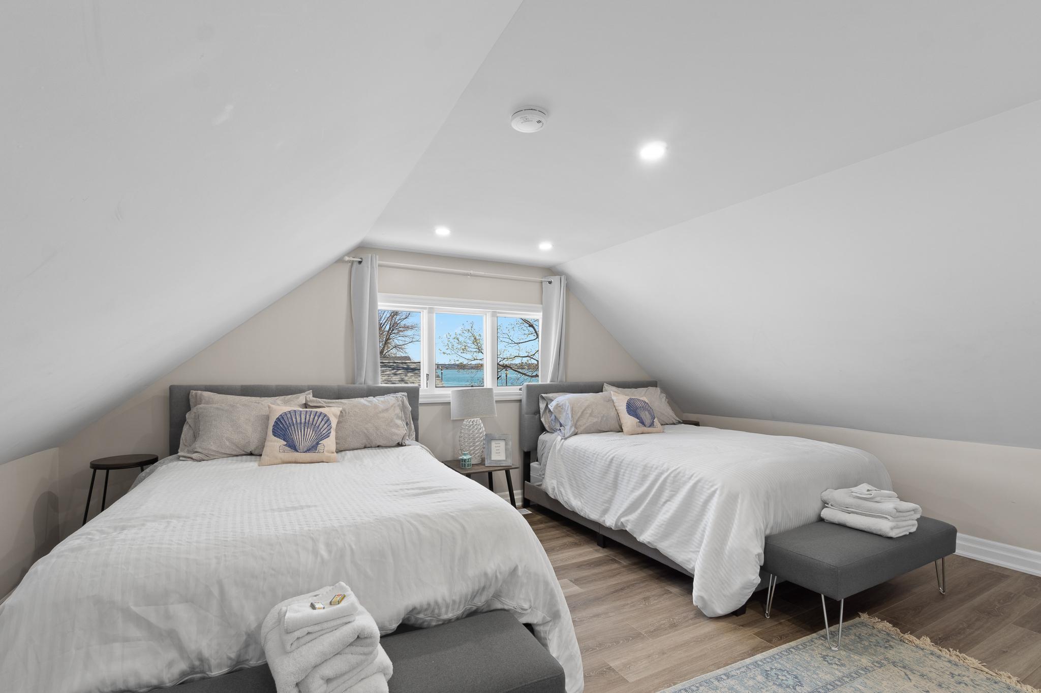 a bedroom with two beds