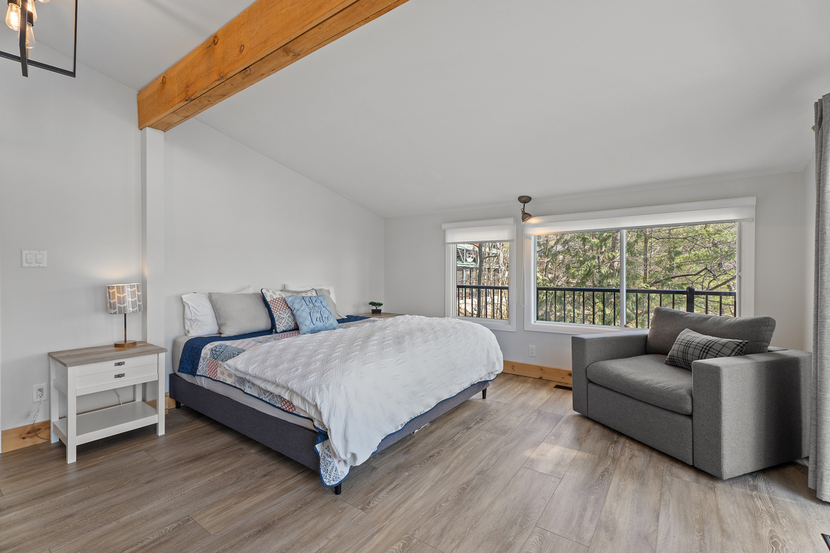 Reverse view of quilted bed with white cover