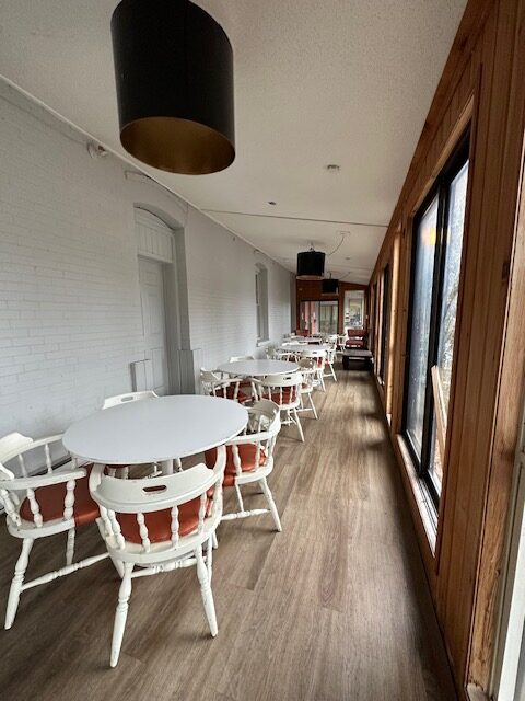 a corridor of tables and chairs