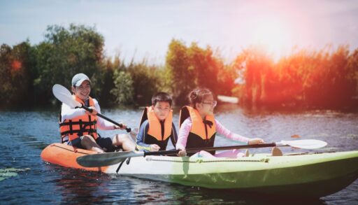 family in a canoe wearing a life jacket